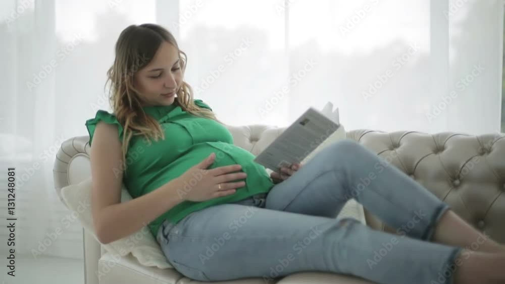 The woman is relaxing lying on the couch. The woman is relaxing lying on the couch.