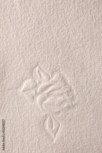 Textured paper with embossed rose