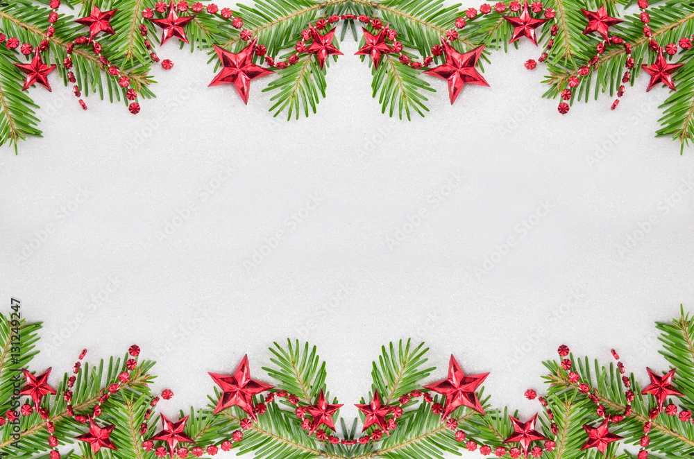 Fir tree branches and star shaped Christmas ornaments Fir tree branches and star shaped Christmas ornaments