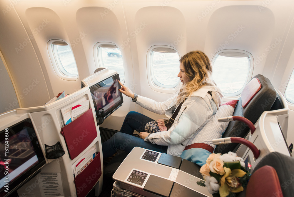 Obraz premium Passenger in business class of airplane