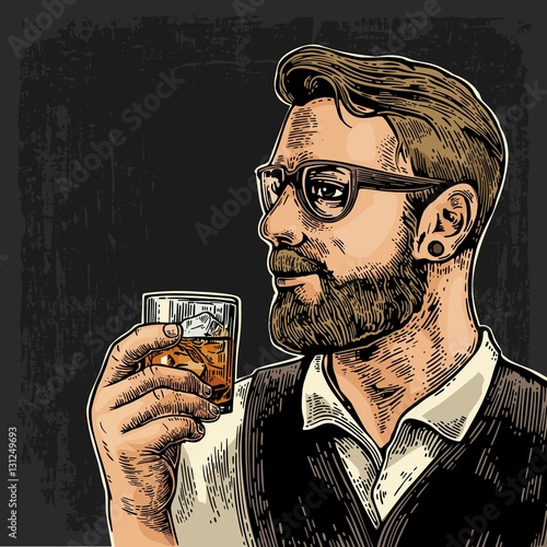Hipster holding a glass of whiskey
