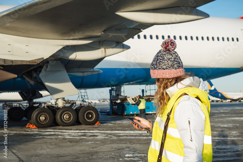 Service team inspecting the security of aircraft before the flig photo