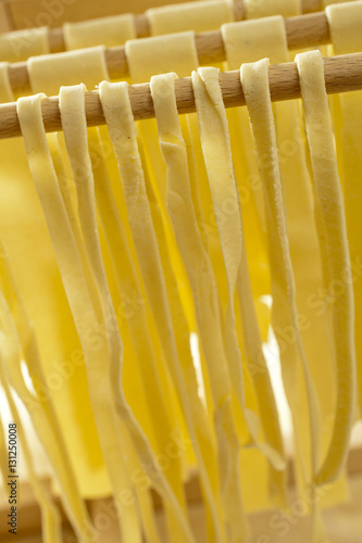 Canvas-taulu Home made semolina noodles on an Italian pasta drying rack