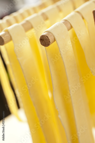 Valokuva Home made semolina noodles on an Italian pasta drying rack