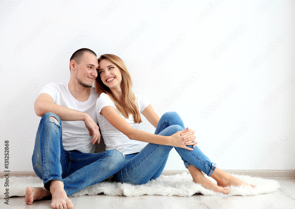 Young couple sitting together Young couple sitting together