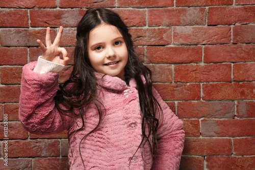 Cute little girl in warm cl...