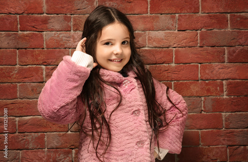 Cute little girl in warm cl...