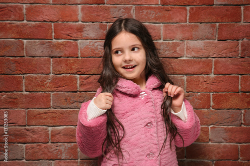 Cute little girl in warm cl...