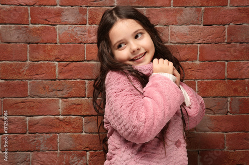 Cute little girl in warm cl...
