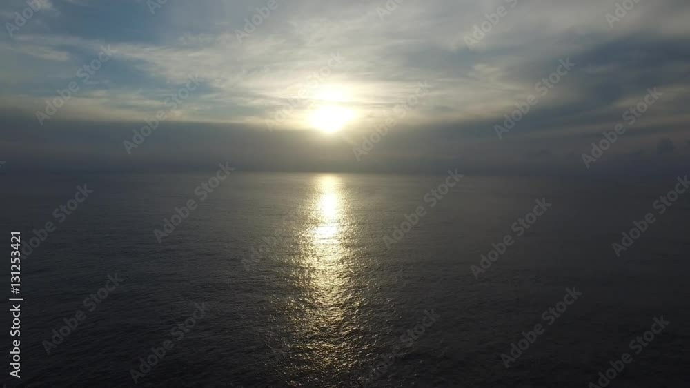 Flying over sailboat in the ocean at sunset. Aerial view. Flying over sailboat in the ocean at sunset. Aerial view.