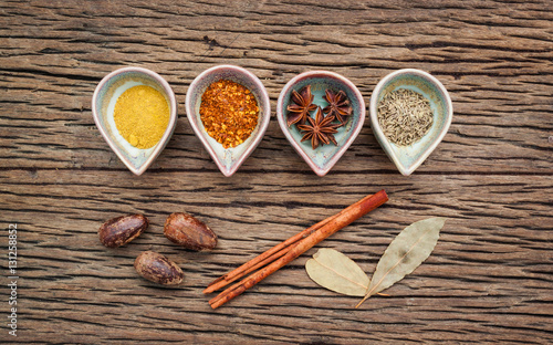 Various herbs and spices in ceramic bowl . Food and cuisine ingr photo