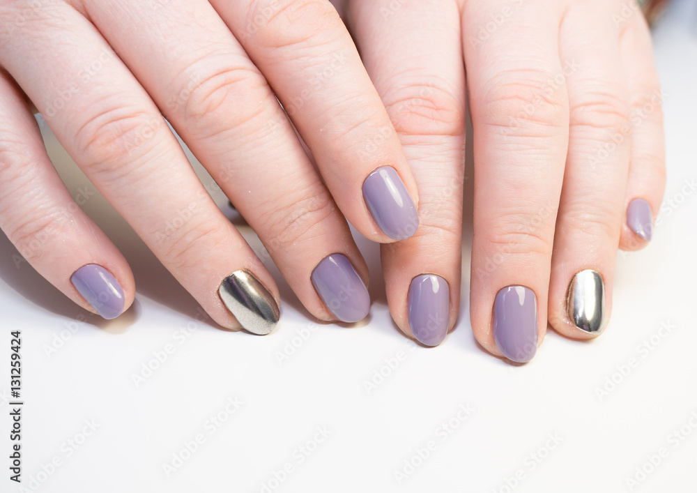 Perfect manicure and natural nails. Attractive modern nail art design. Gel polish applied.