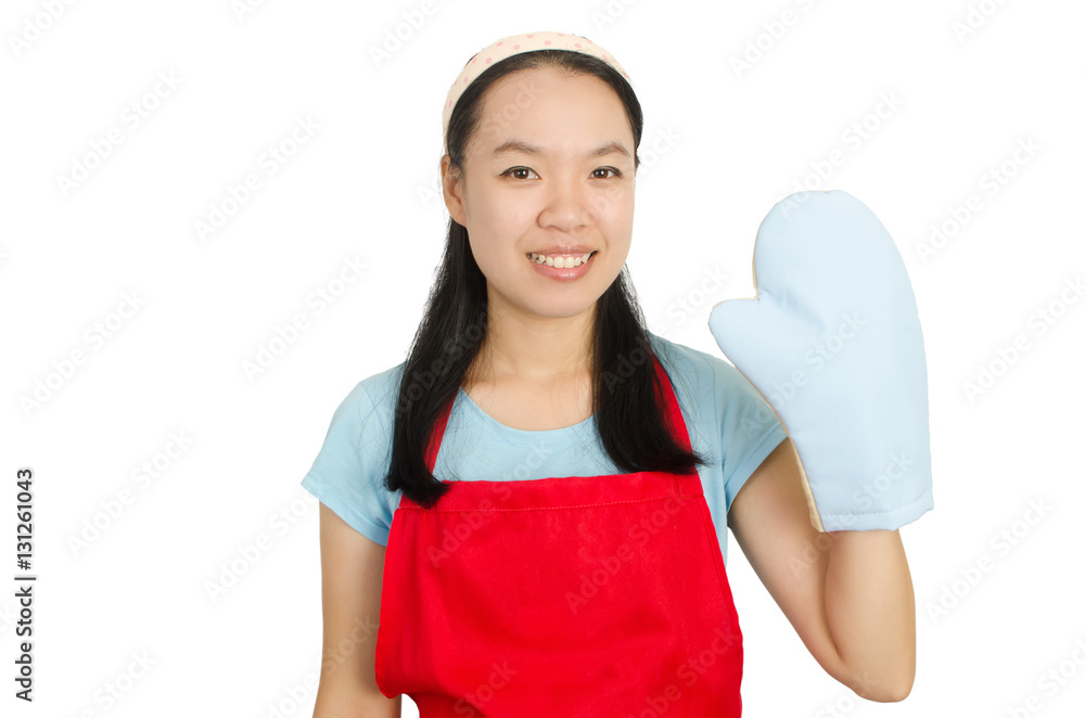 Young Asian woman wearing red apron and oven mittens ready to cooking or baking,isolated on white background Young Asian woman wearing red apron and oven mittens ready to cooking or baking,isolated on white background
