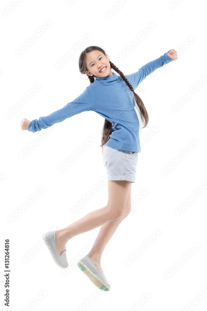 Portrait of happy little Asian child girl jumping isolated on white