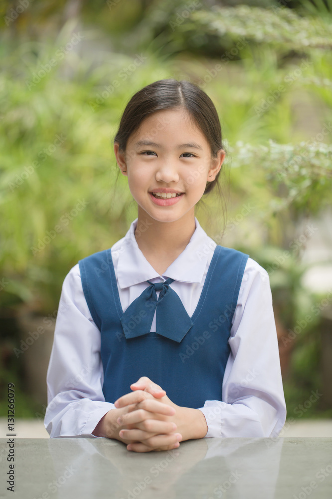 Portrait of smiling Asian school girl in school uniform Stock Photo | Adobe  Stock