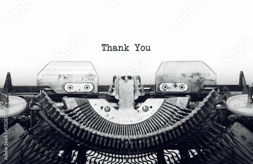 Vintage typewriter on white background with text thank you.