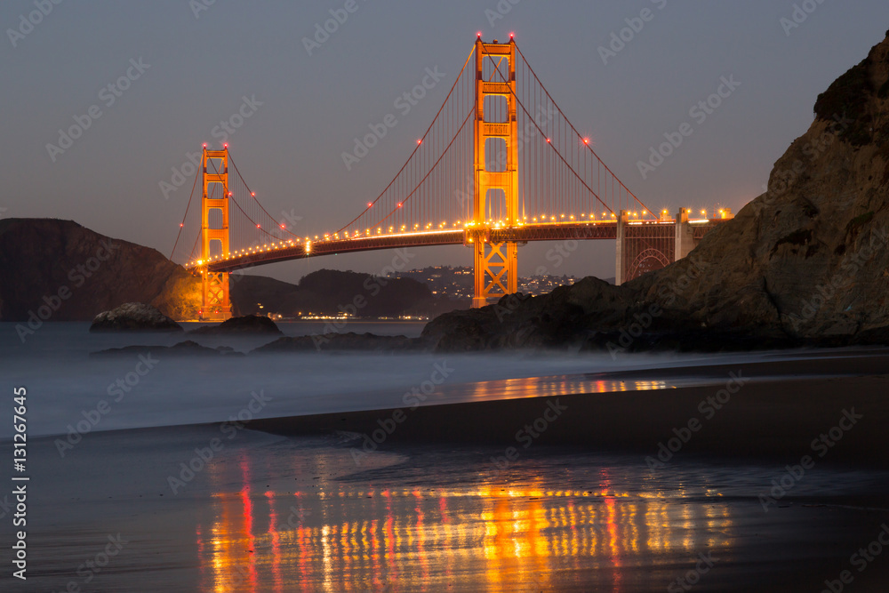 Fototapeta premium The Golden Gate Bridge and Water Reflection. Baker Beach, San Francisco, California, USA.