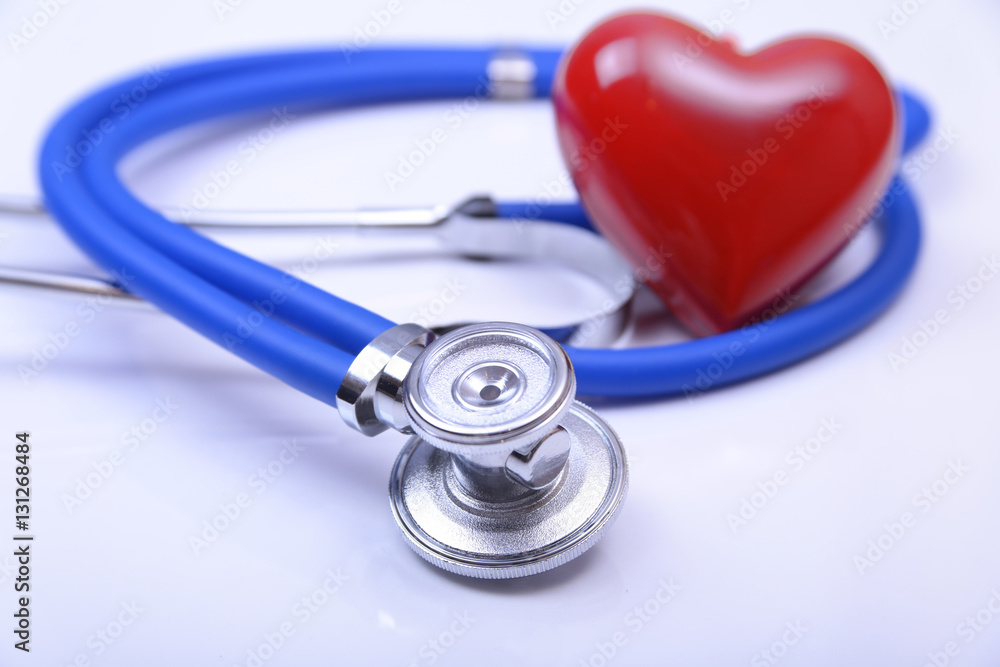 Cardiogram with stethoscope and red heart on table, closeup Cardiogram with stethoscope and red heart on table, closeup