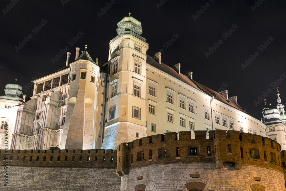 View of the illuminated at night Wawel Royal Castle, Krakow, Poland
