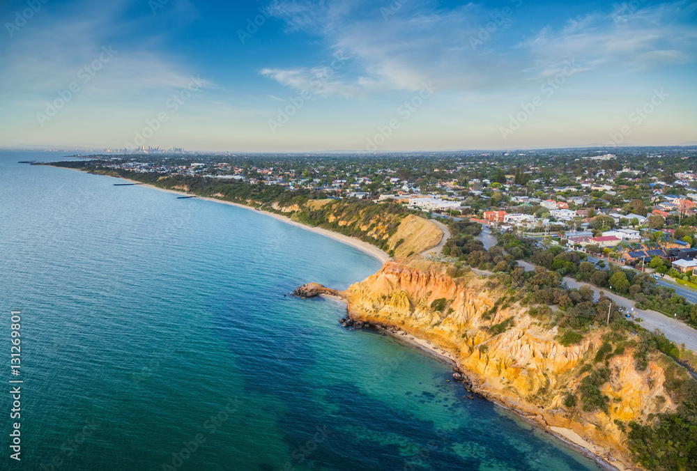 Aerial panorama of Black Rock suburban area and beautiful colorfoll cliffs of the coastline at sunset. Melbourne, Victoria, Australia