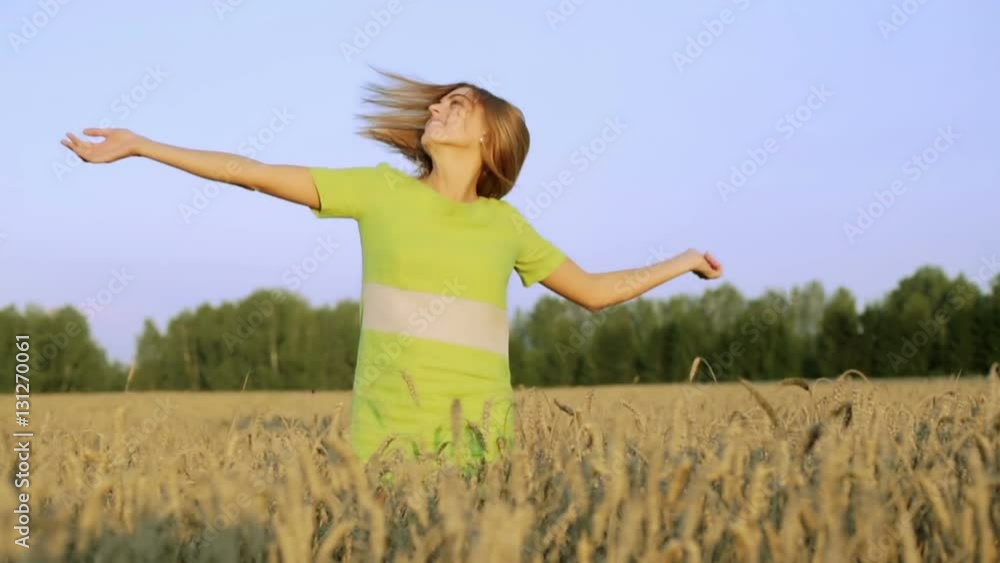 Slow motion. Beautiful lady having fun in the field. Slow motion. Beautiful lady having fun in the field.