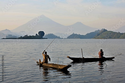 Fishermen and workers in african congo, wild and nature in africa, beautiful landscape view, green jungle and mountains photo