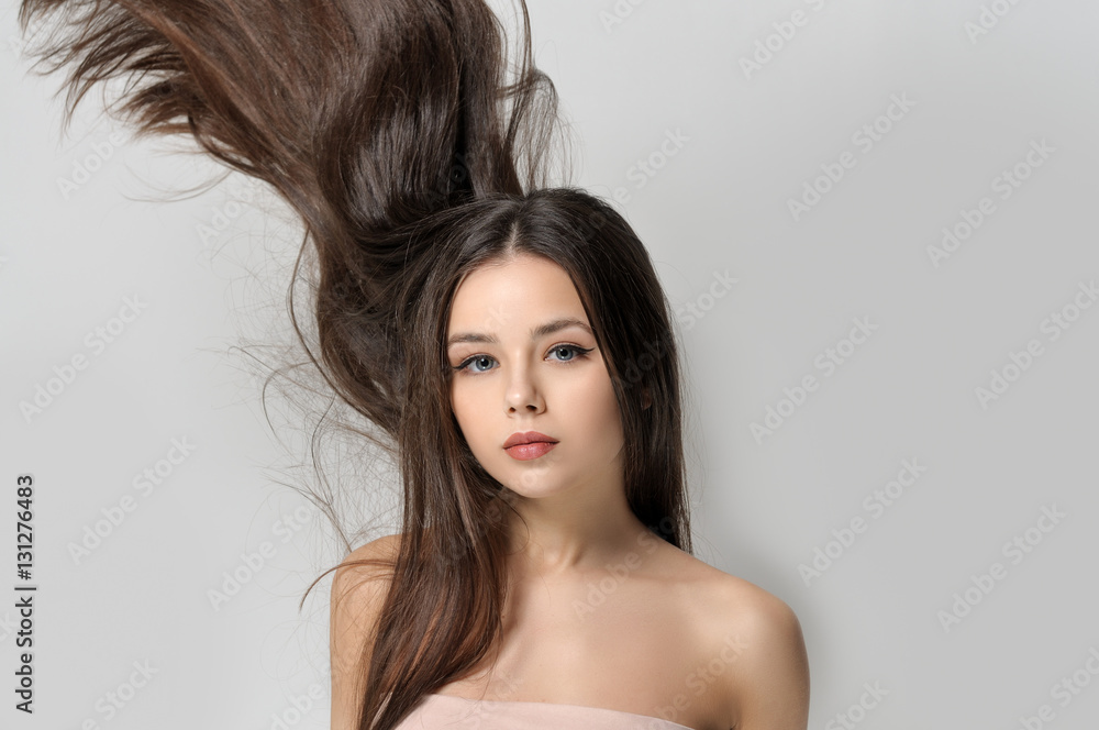 Naklejka premium Long brown hair go up