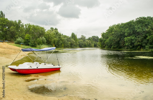 Catamaran on the bank of the lake