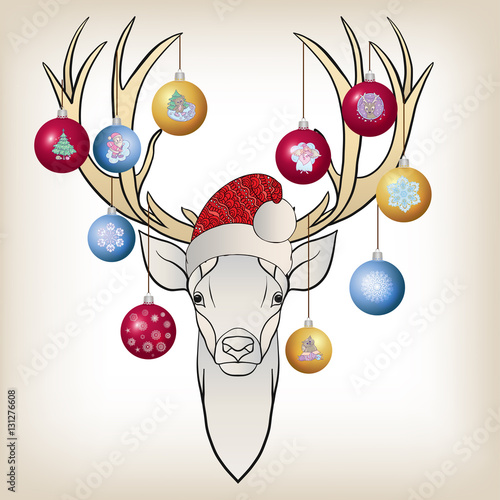 Deer head in the cap of Santa Claus with New Year's balls on the