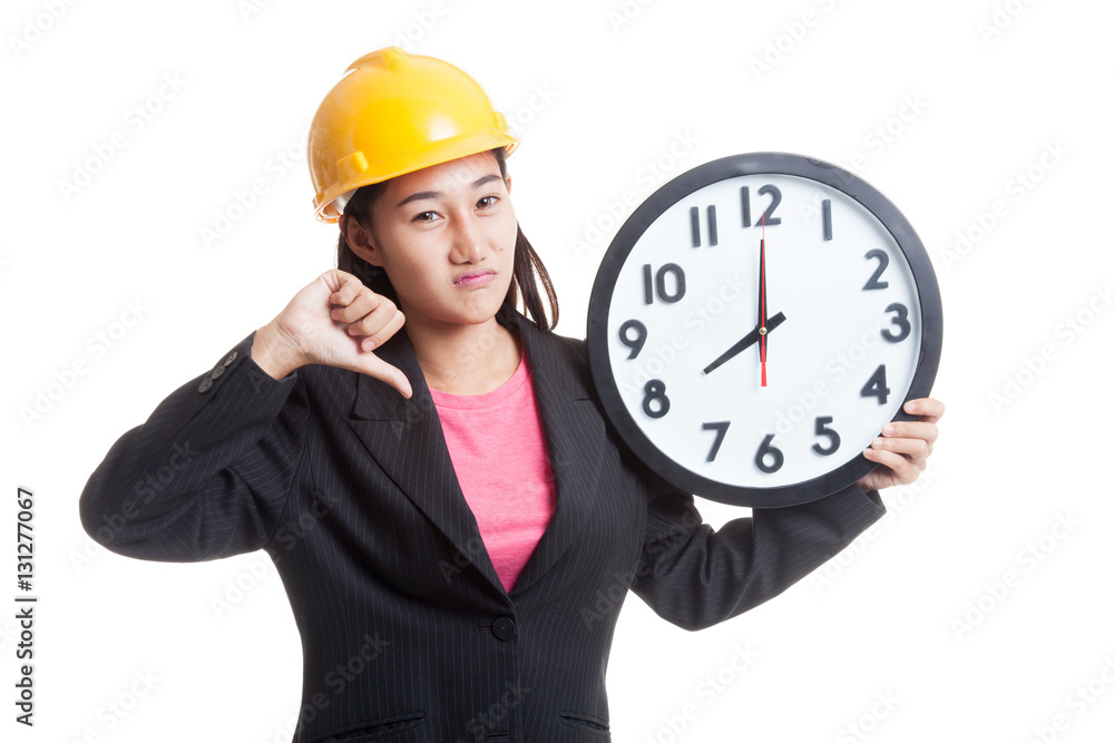Asian engineer woman thumbs down with a clock. Asian engineer woman thumbs down with a clock.