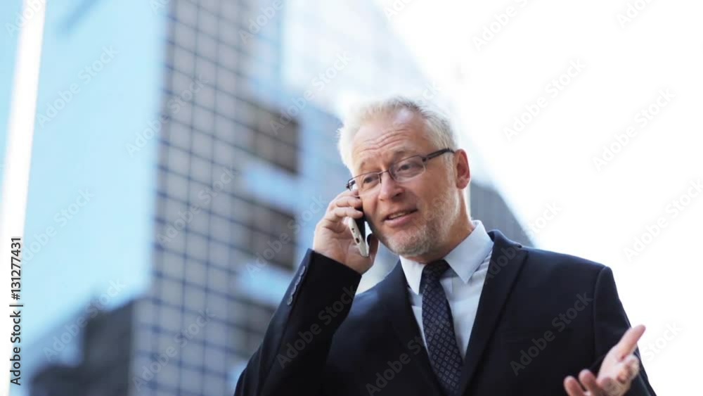 senior businessman calling on smartphone in city senior businessman calling on smartphone in city