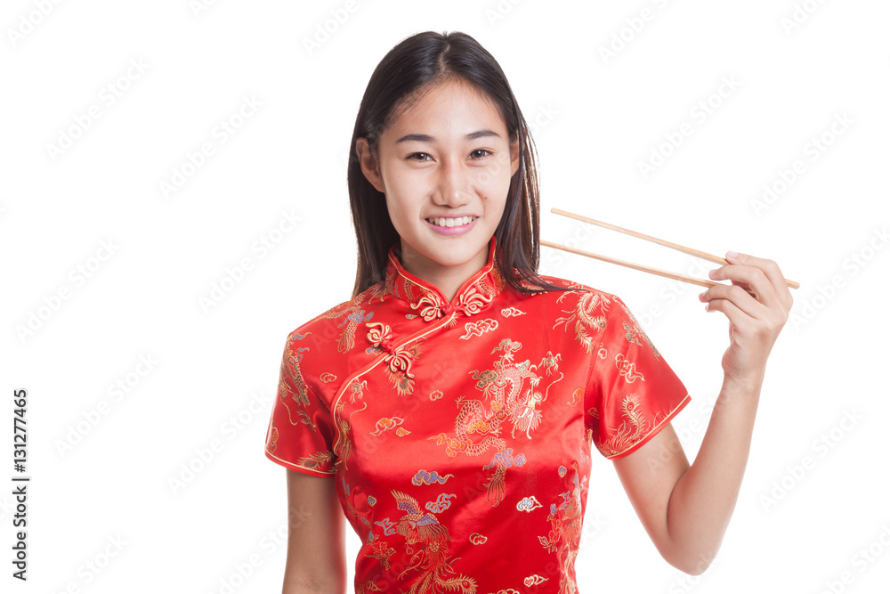Asian girl in chinese cheongsam dress with chopsticks. Asian girl in chinese cheongsam dress with chopsticks.