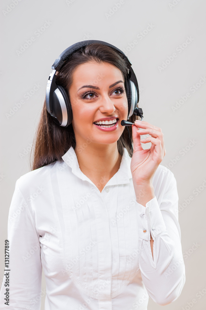 Studio shot portrait of young successful customer service operator. Studio shot portrait of young successful customer service operator.