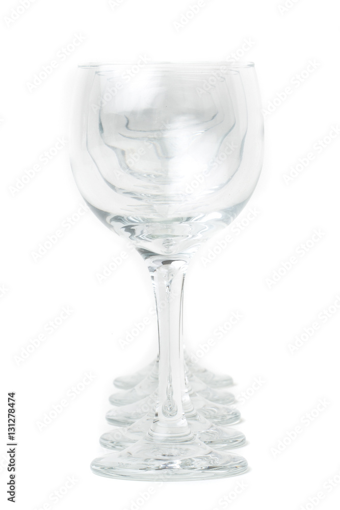 Wine glasses arranged on a table, isolated over white Wine glasses arranged on a table, isolated over white