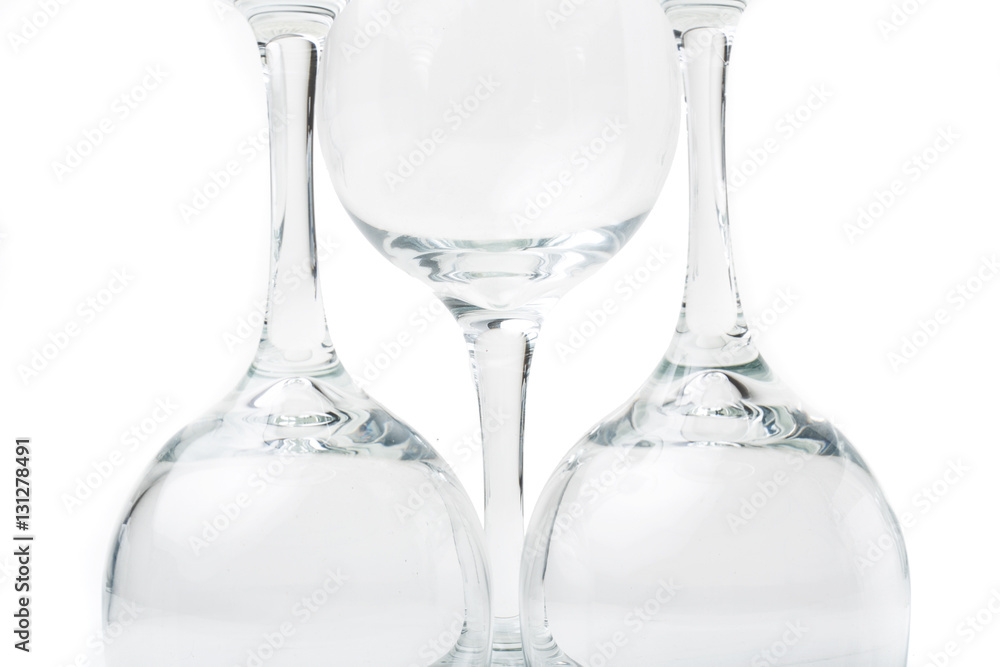 Wine glasses arranged on a table, isolated over white Wine glasses arranged on a table, isolated over white