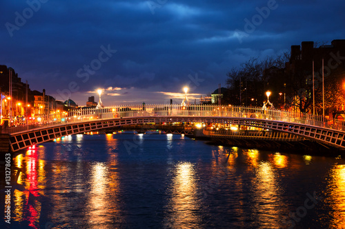 Canvas Print Dublin, Ireland. Night view of famous Ha Penny bridge