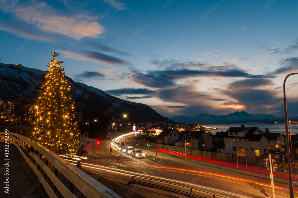 Night view of Tromso Bridge with lights in the city of Tromso in Norway