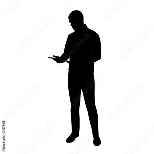Young tall man standing and holding tablet in his hands, vector