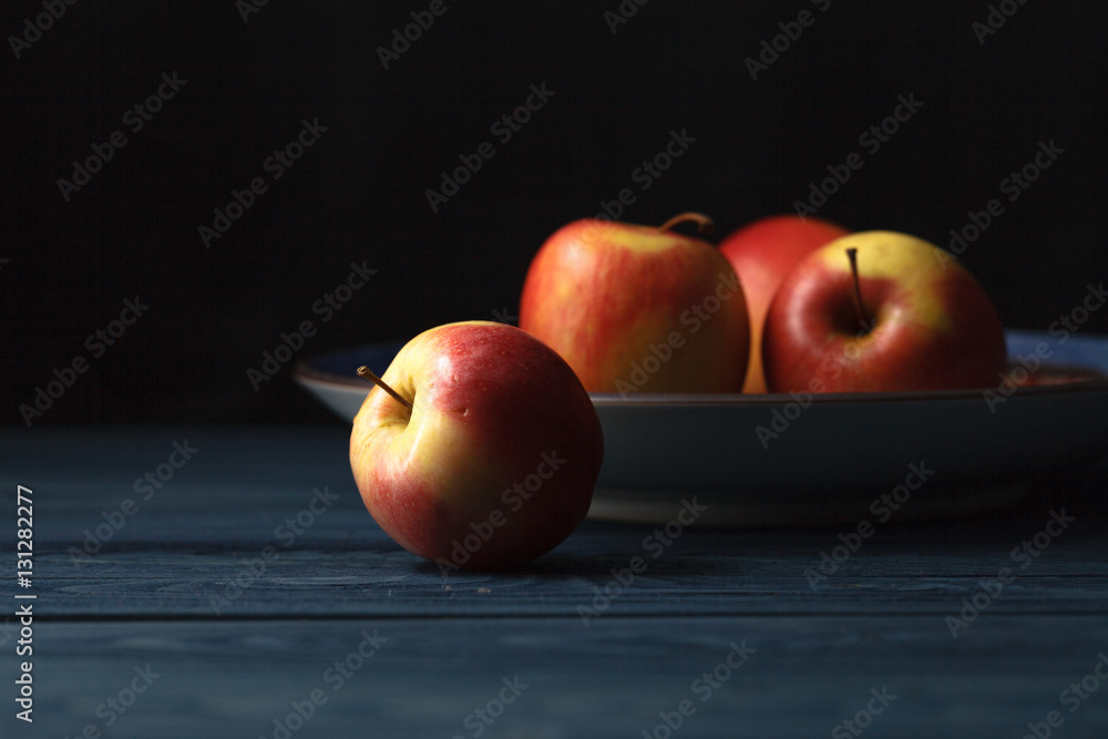 Fresh red apples on wooden blue background Fresh red apples on wooden blue background