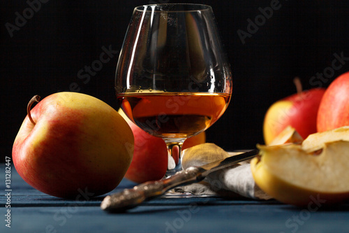 glass of Calvados Brandy and red apples