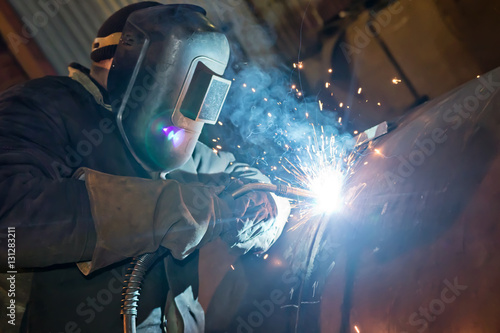 Semi-automatic welding with sparks and smoke