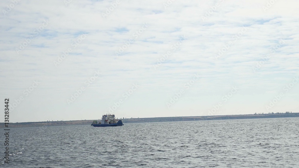 small ship floats in the sea bay wave water splash