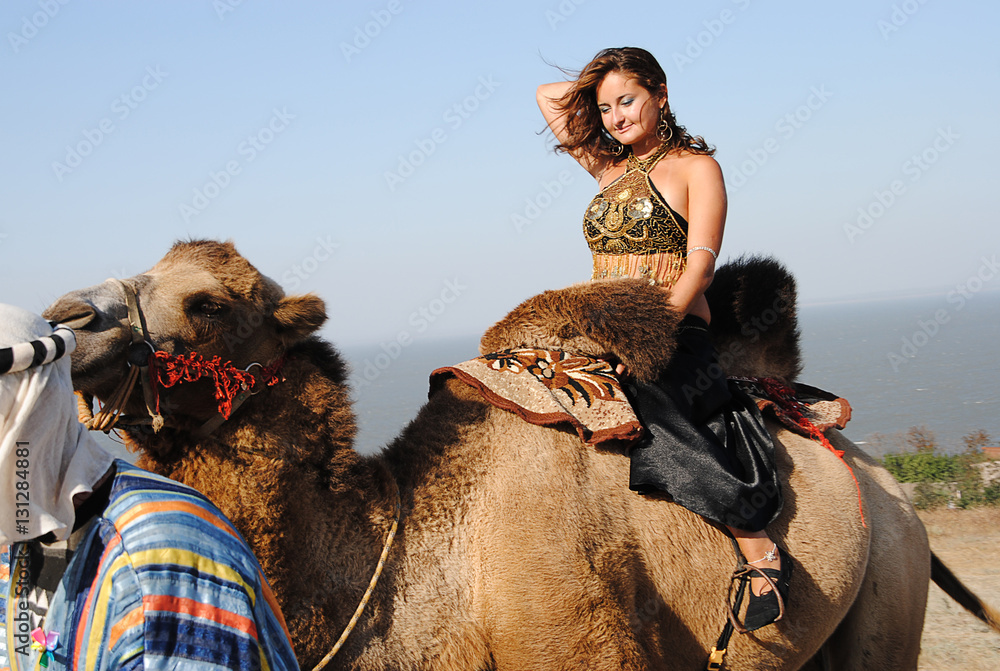 woman on camel Stock Photo | Adobe Stock