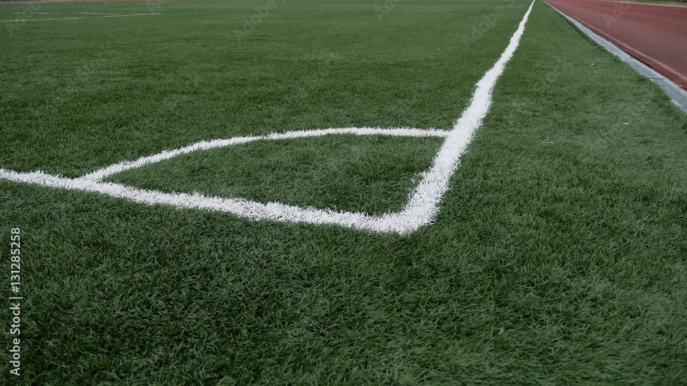 Obraz premium football Soccer field corner with green artificial sport grass