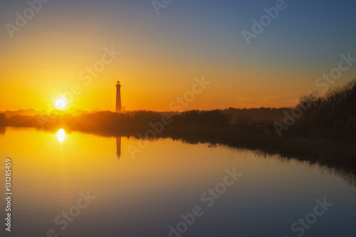 Lighthouse sunset reflections 
