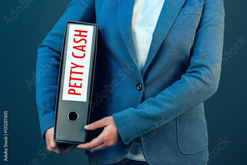 Tracking petty cash with businesswoman and ring binder