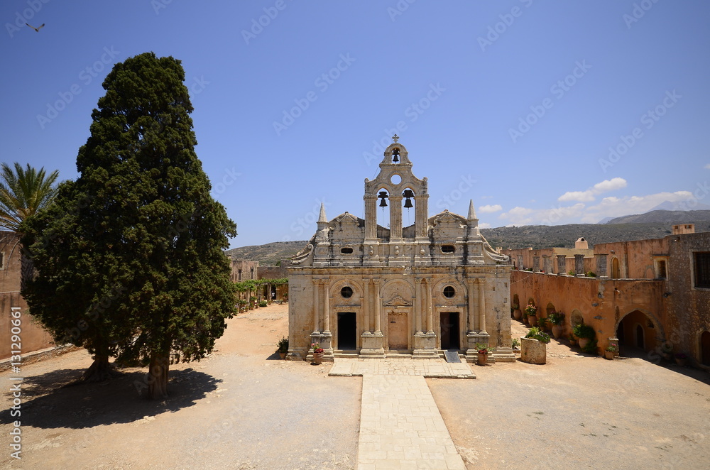 Arkadi monastery on Crete island, Greece. Ekklisia Timios Stavros - Moni Arkadiou in Greek. It is a Venetian baroque church. Details of the yard and the buildings outside the church.