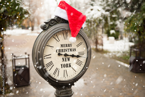 Wall Mural vintage clock with santa hat and words Merry Christmas New York