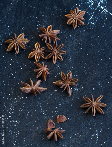 Star anise spilled on a dark background

