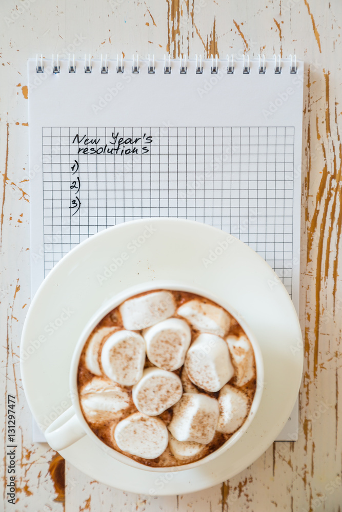 Fototapeta premium Making list of New Year's resolutions